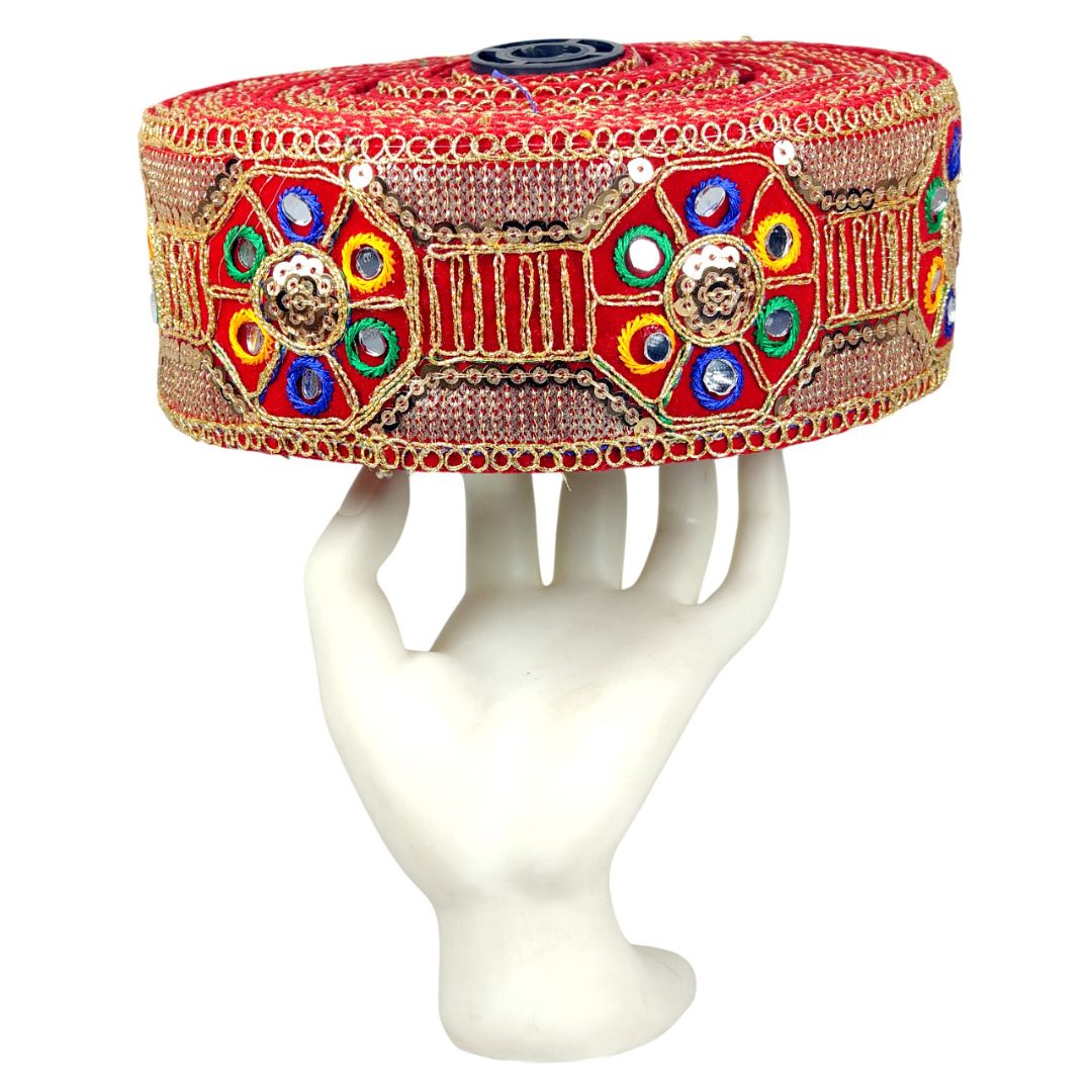 Decorative headband with colorful gemstones on a white stand